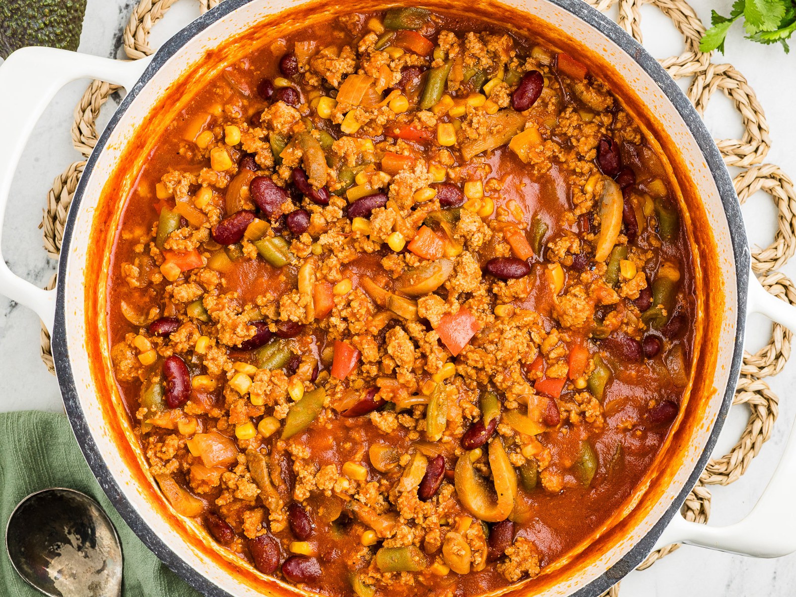 Finished vegetable turkey chili in a white Dutch oven