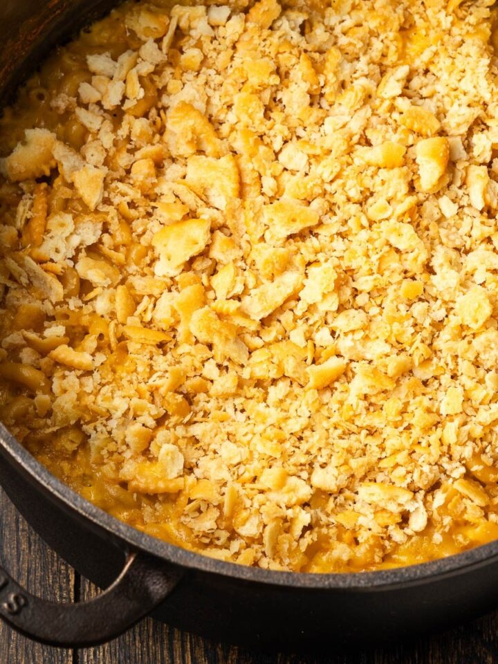 Dutch oven mac and cheese with crispy cracker topping in a cast iron dutch oven