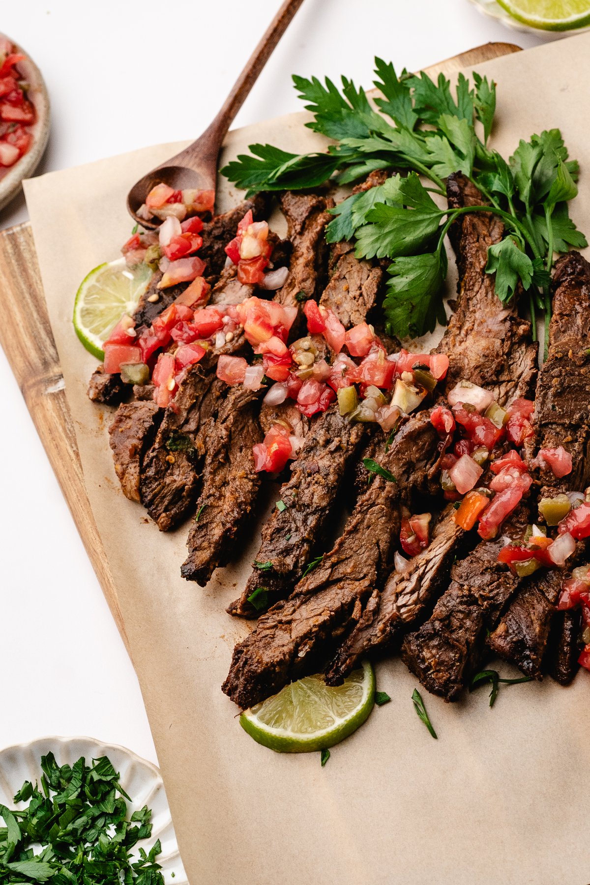Sliced marinated steak topped with pico de gallo