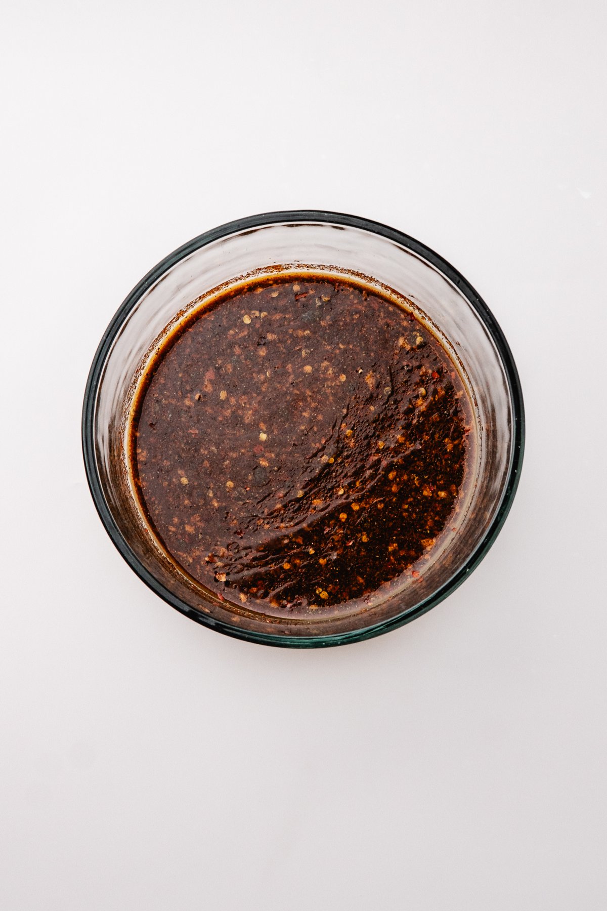 Whisked steak marinade in a glass bowl