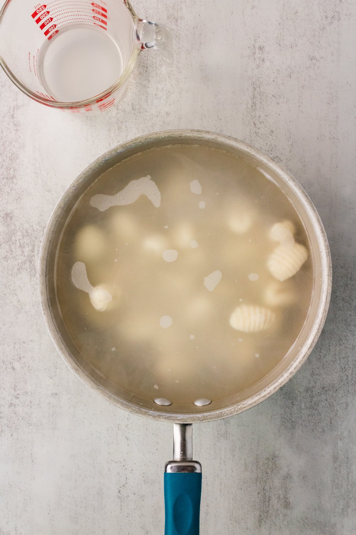 Potato gnocchi cooking in a pot of salted boiling water