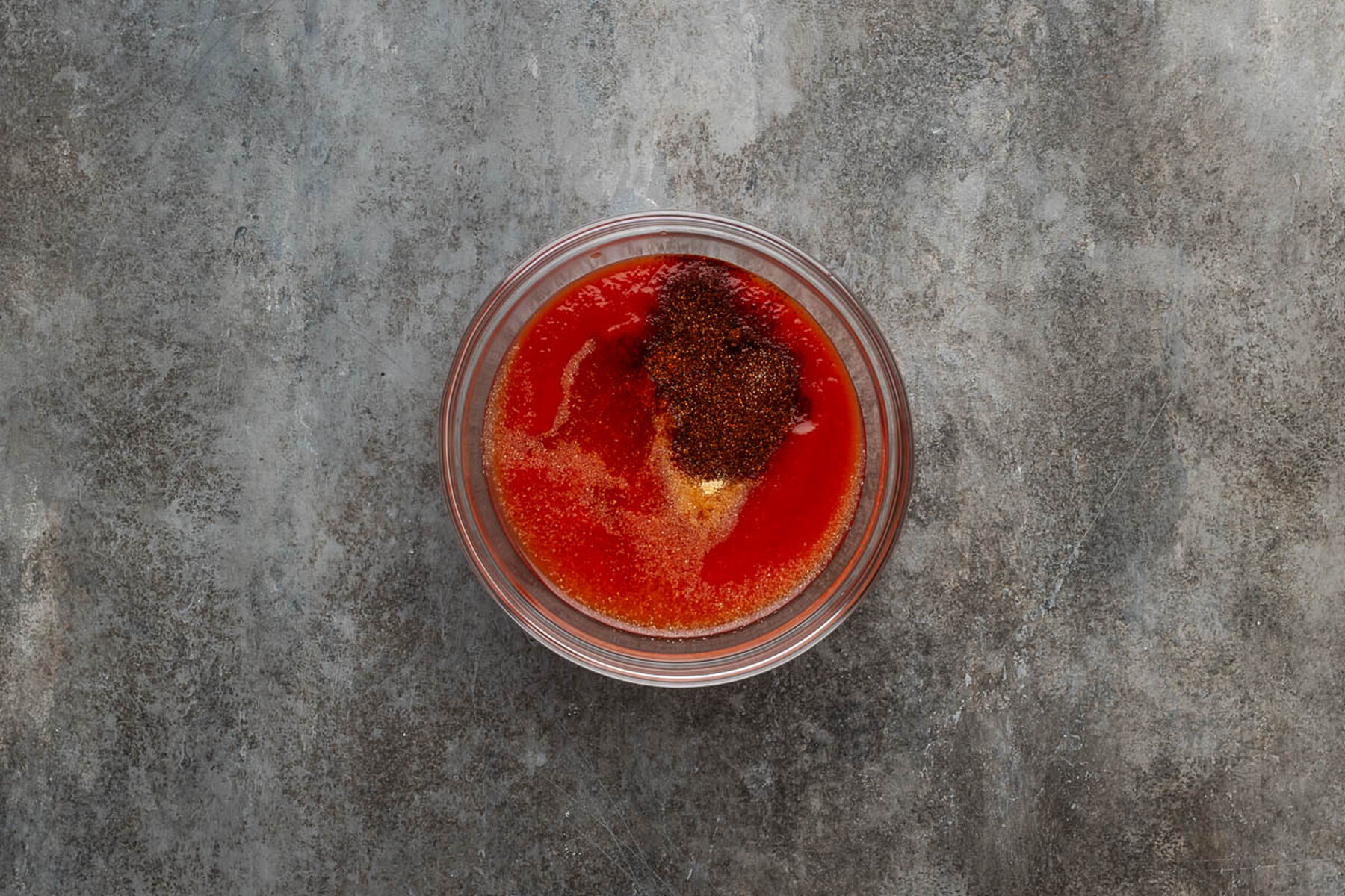 Tomato sauce and tomato paste in a glass bowl for the spaghetti sauce