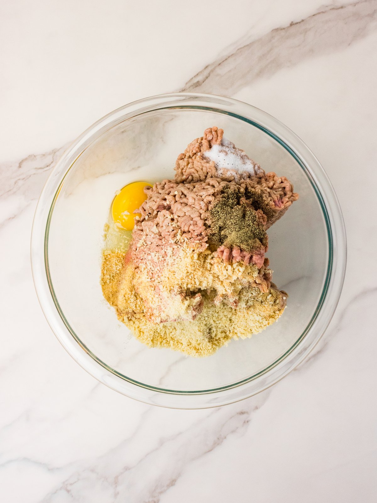 Mixing hamburger steak ingredients in a bowl